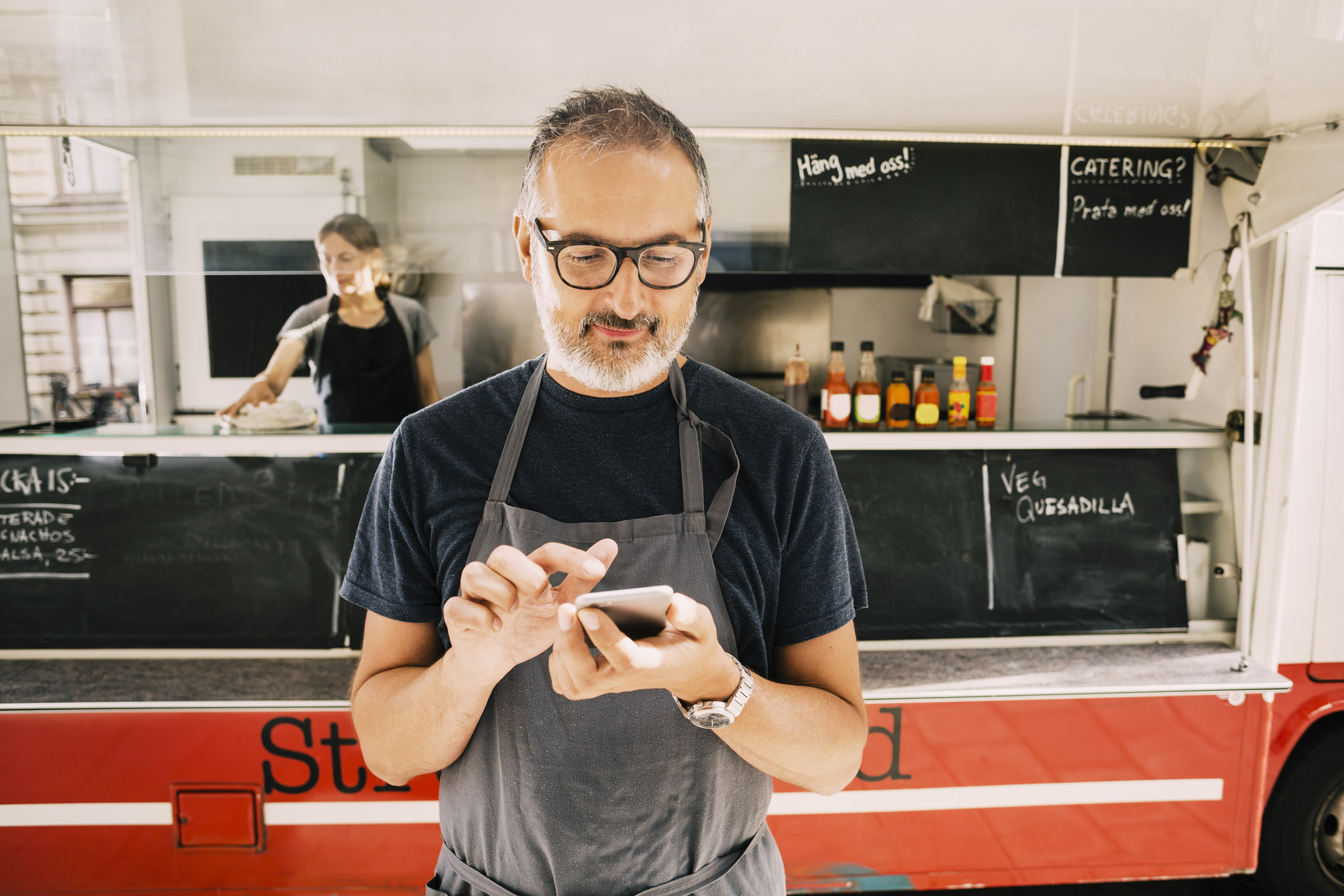 cafe owner on mobile phone